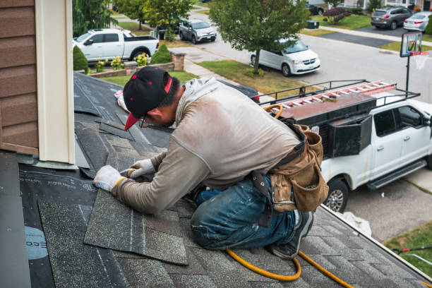 Professional Roofing technician working in Bedford, MA